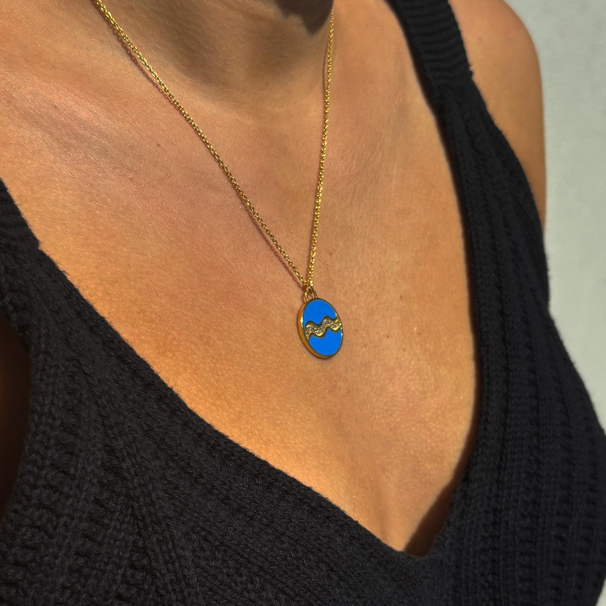 Celestial Aquarius Necklace – Gold Water Bearer with Aqua Blue Enamel